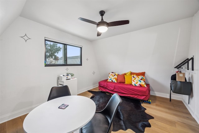 bedroom with ceiling fan, light hardwood / wood-style floors, and lofted ceiling