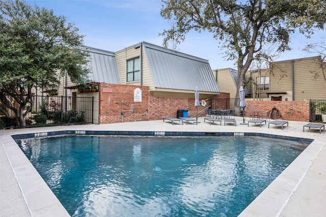 view of pool featuring a patio