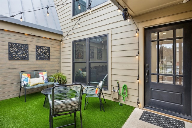 doorway to property featuring a yard