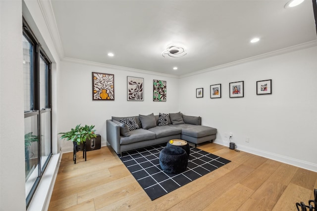 living room with crown molding and hardwood / wood-style floors