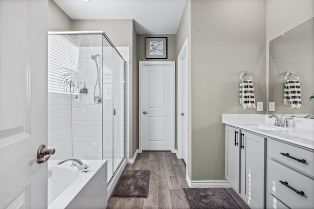 bathroom with vanity and independent shower and bath