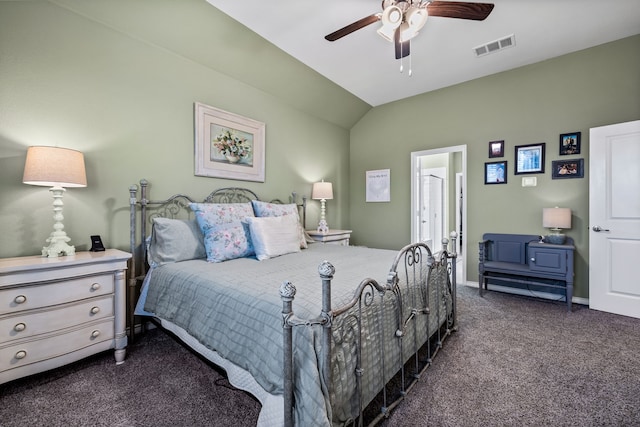 carpeted bedroom with ceiling fan and vaulted ceiling