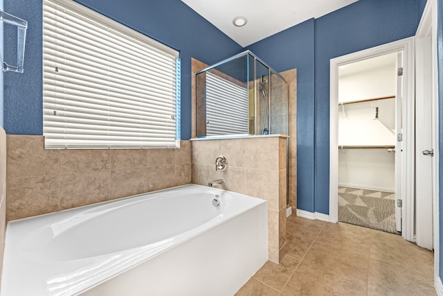 bathroom featuring tile patterned flooring and plus walk in shower