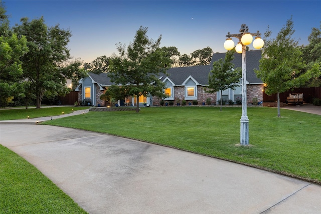 view of front of home featuring a lawn