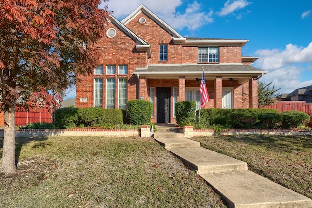 view of front of house featuring a front yard and a porch