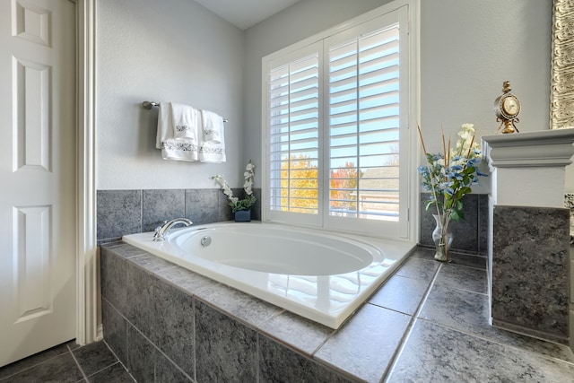 bathroom featuring tiled bath