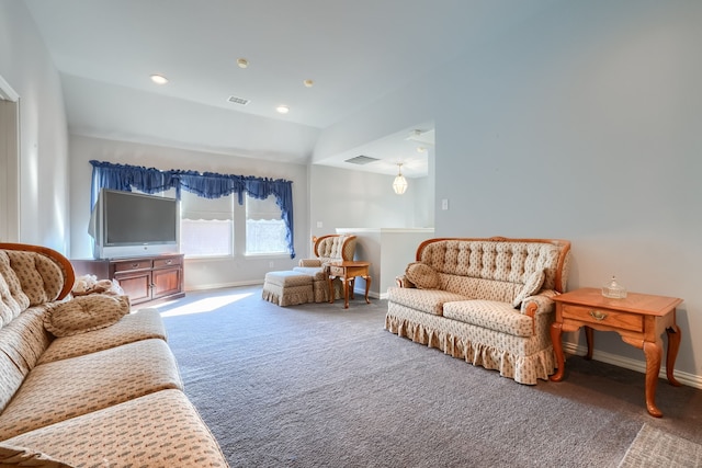 living area with carpet floors and vaulted ceiling