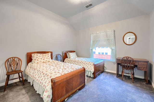 carpeted bedroom with vaulted ceiling