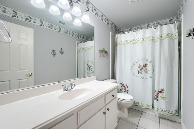 bathroom featuring tile patterned floors, vanity, toilet, and a shower with shower curtain