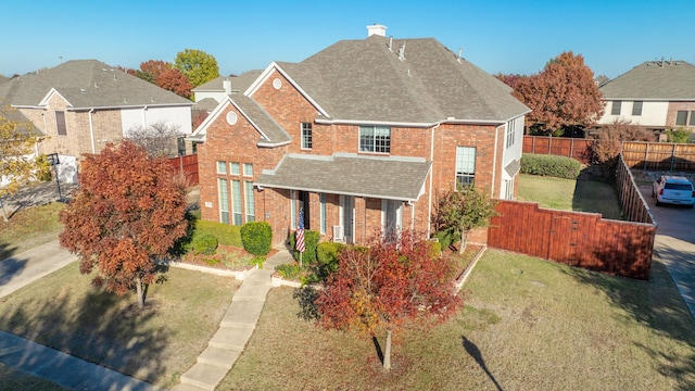 front facade with a front lawn