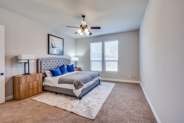 bedroom with baseboards, ceiling fan, visible vents, and light colored carpet