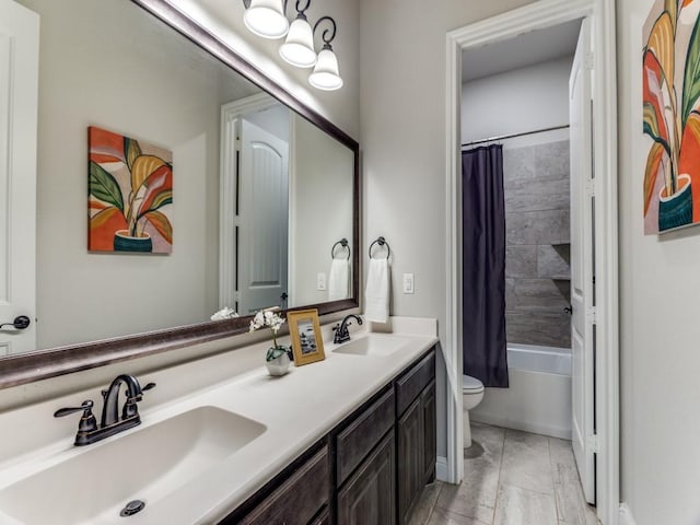 full bath with toilet, a sink, double vanity, and shower / bathtub combination with curtain