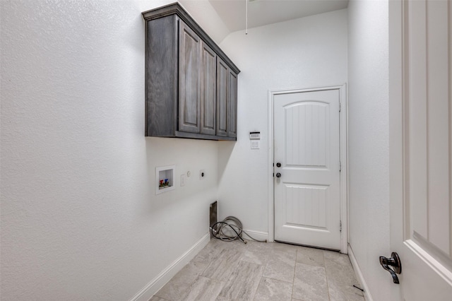 washroom with cabinet space, hookup for a washing machine, baseboards, and hookup for an electric dryer