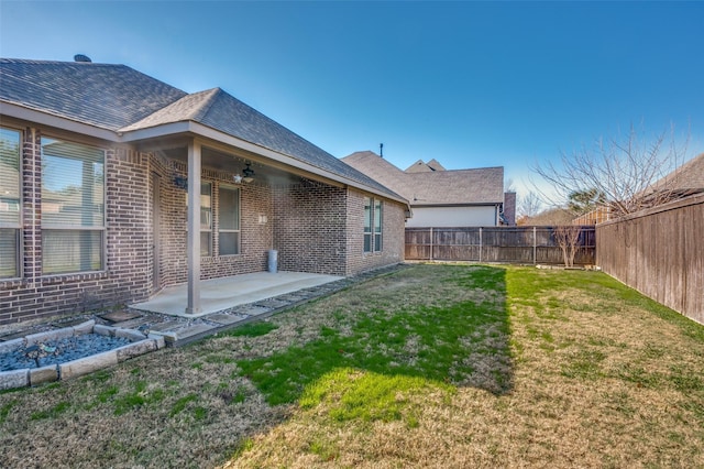 exterior space featuring a fenced backyard, a ceiling fan, and a patio