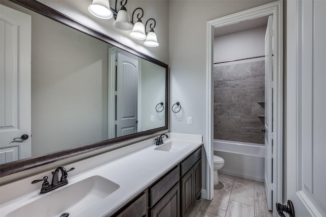 bathroom featuring shower / bath combination, a sink, toilet, and double vanity