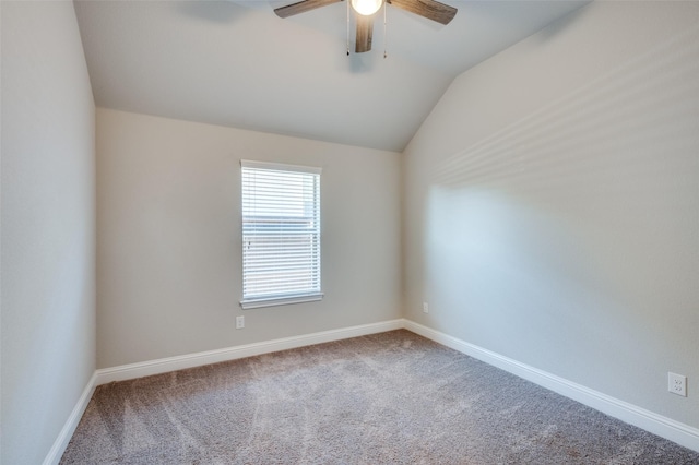 unfurnished room with a ceiling fan, baseboards, vaulted ceiling, and carpet flooring