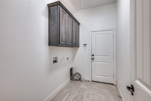 laundry area featuring hookup for a washing machine, cabinet space, baseboards, and electric dryer hookup