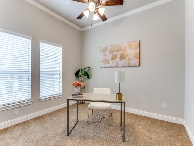 office area featuring ornamental molding, carpet floors, a ceiling fan, and baseboards