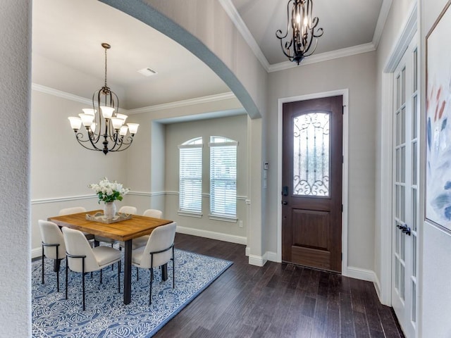 929 Merion Dr, Fort Worth, TX 76028 - entrance foyer featuring a chandelier, dark wood-style floors, arched walkways, and crown molding