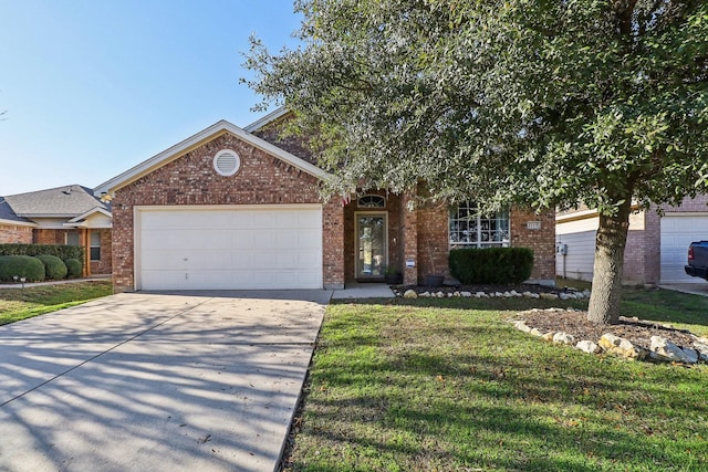 view of front of property featuring a front yard and a garage