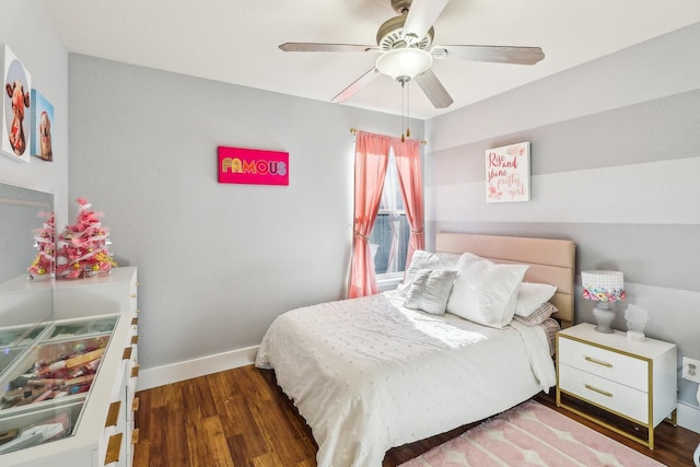 bedroom with ceiling fan and dark wood-type flooring