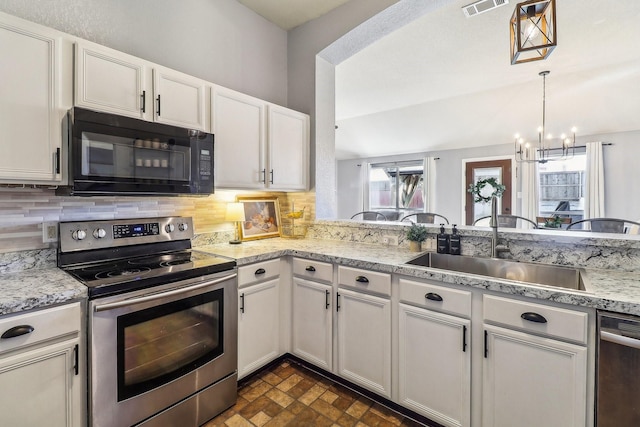 kitchen with sink, white cabinets, and appliances with stainless steel finishes