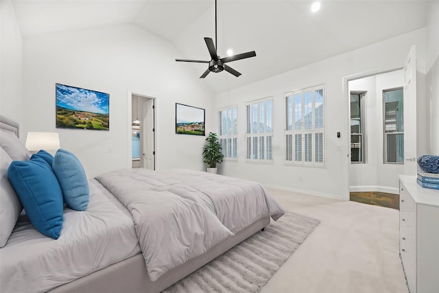 carpeted bedroom with lofted ceiling, a ceiling fan, and baseboards