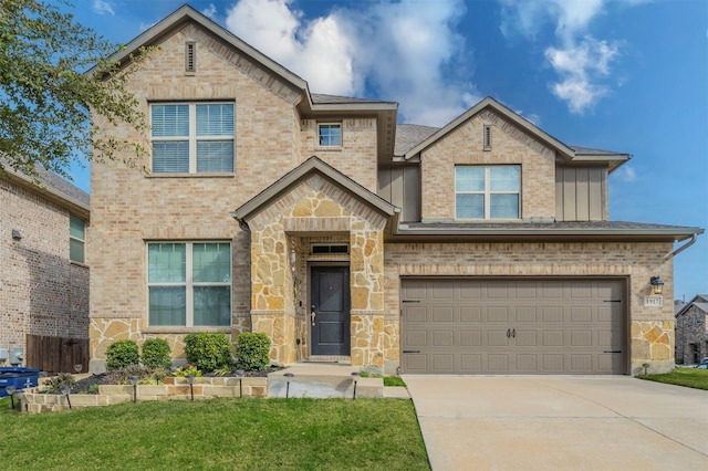 view of front of property featuring a front yard and a garage