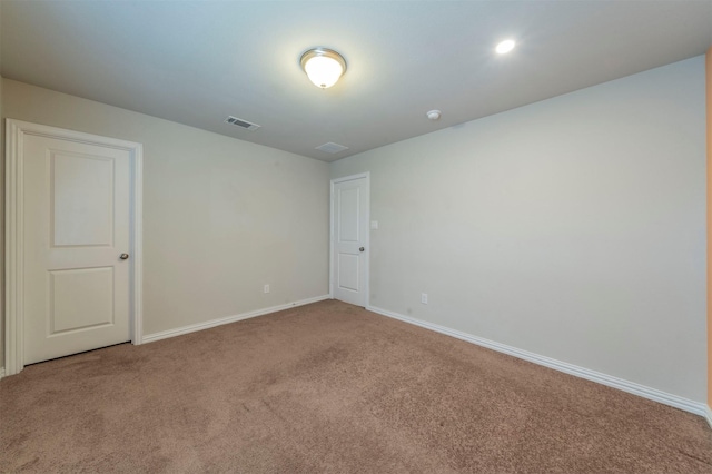 empty room featuring carpet flooring