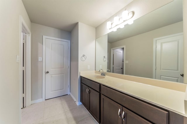 bathroom with tile patterned flooring and vanity