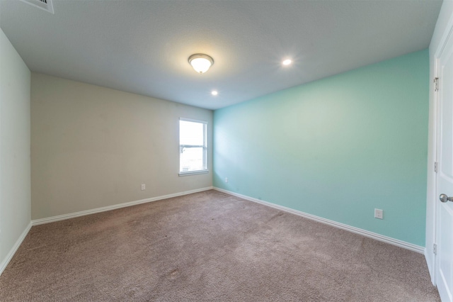 empty room with light colored carpet