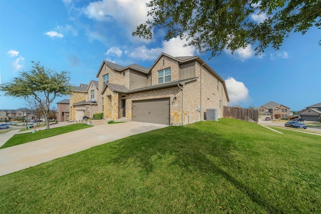 view of front of house featuring central AC, a garage, and a front lawn