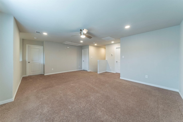 carpeted empty room featuring ceiling fan