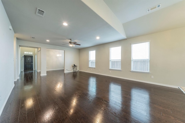 spare room featuring ceiling fan and dark hardwood / wood-style floors