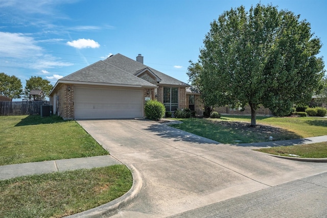 single story home with a garage, a front lawn, and central air condition unit