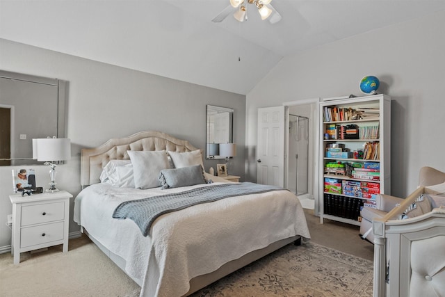 carpeted bedroom with vaulted ceiling and ceiling fan