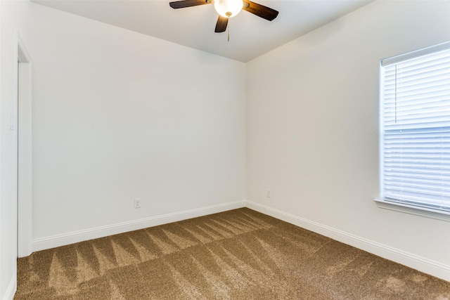 empty room with carpet flooring and ceiling fan