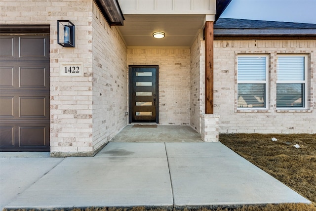 doorway to property featuring a garage