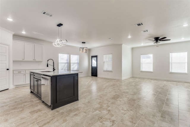 kitchen with pendant lighting, dishwasher, white cabinets, sink, and an island with sink