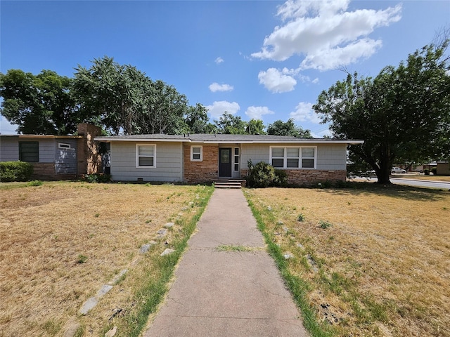 ranch-style home with a front lawn