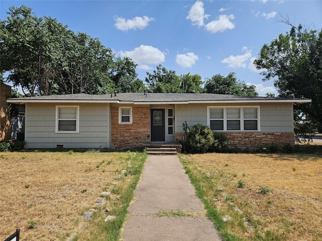 single story home featuring a front yard