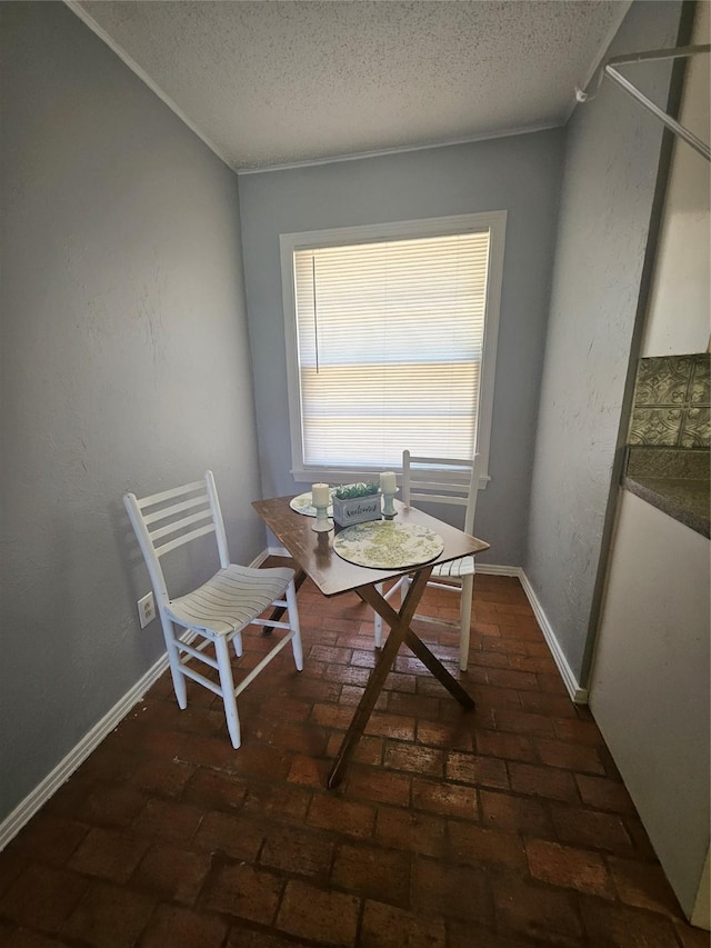 dining area with a textured ceiling