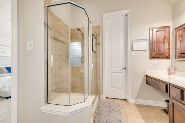 bathroom featuring tile patterned floors, vanity, and walk in shower