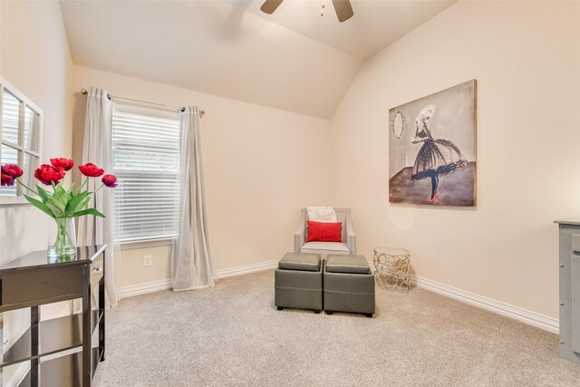 sitting room featuring light colored carpet, ceiling fan, and lofted ceiling