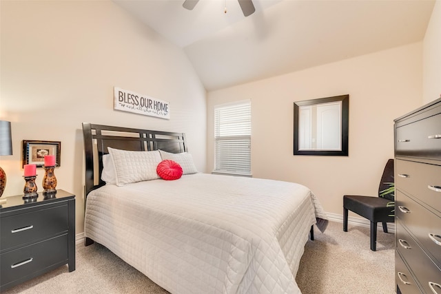 carpeted bedroom with ceiling fan and lofted ceiling