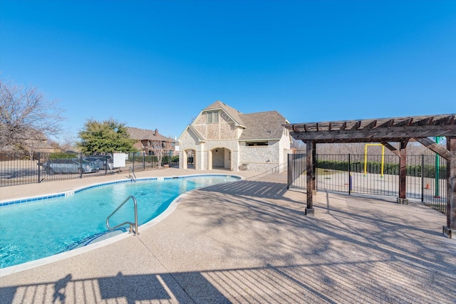 view of swimming pool with a patio area, a pergola, and an outdoor fireplace