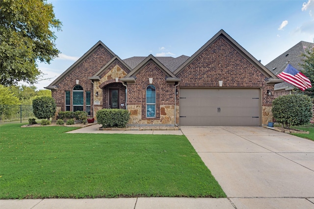 view of front facade with a garage and a front yard