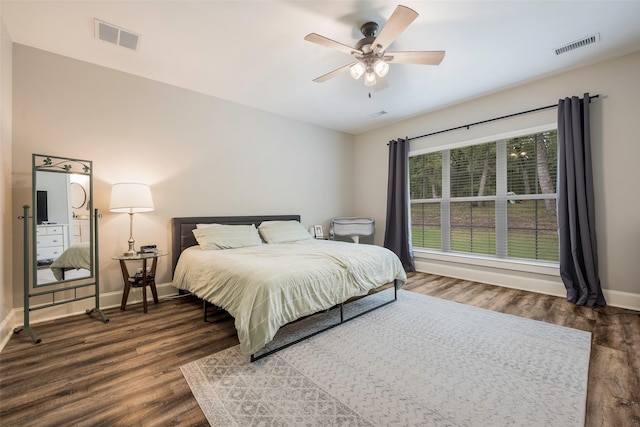 bedroom featuring dark hardwood / wood-style flooring and ceiling fan