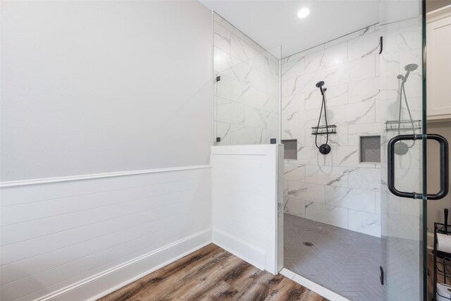 bathroom featuring walk in shower and wood-type flooring