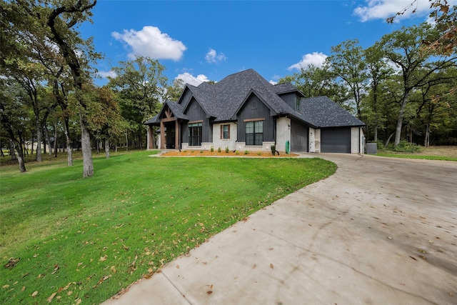 view of front of property with a garage and a front yard